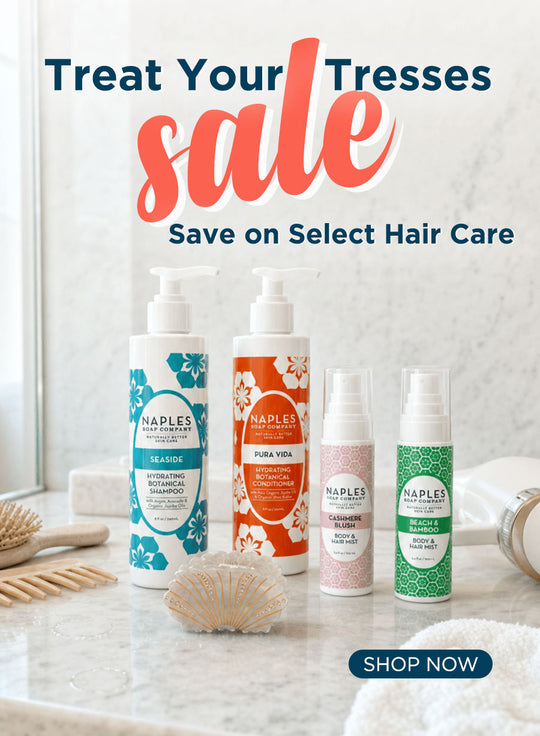 Four Naples hair care products displayed on a marble bathroom counter with a seashell prop, alongside large promotional text reading 'Treat Your Tresses sale' and a 'SHOP NOW' button.
